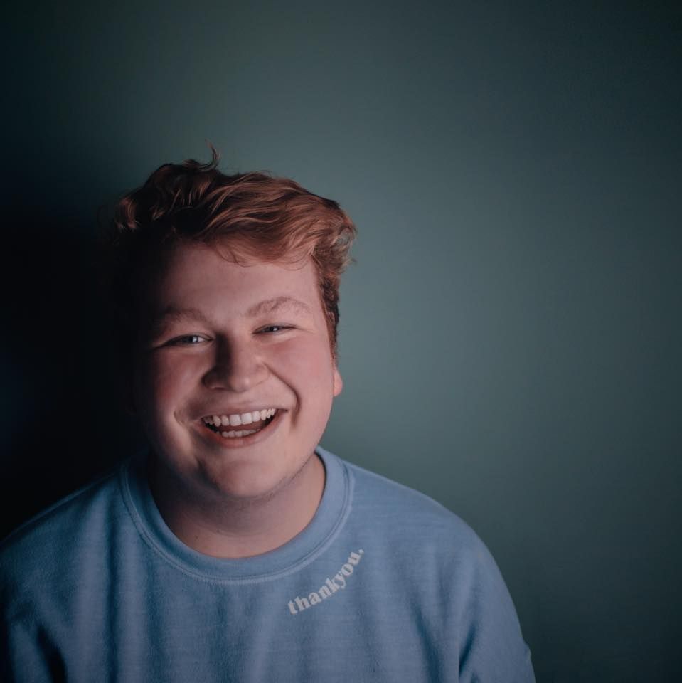 Image may contain: Mouth, Teeth, Lip, Boy, Laughing, Sleeve, Clothing, Apparel, Smile, Human, Person, Face