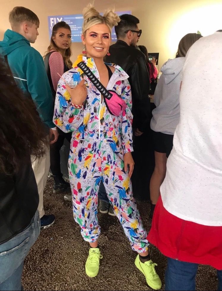 Image may contain: People, Female, Costume, Smile, Sleeve, Face, Footwear, Shoe, Human, Person, Clothing, Apparel