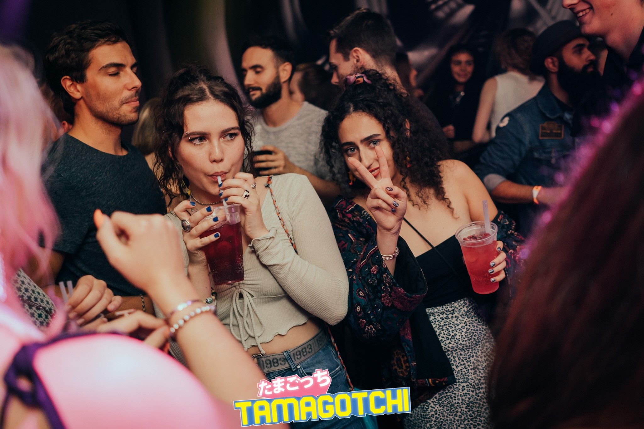 Image may contain: Bar Counter, Pub, Audience, Crowd, Night Life, Party, Night Club, Club, Person, Human
