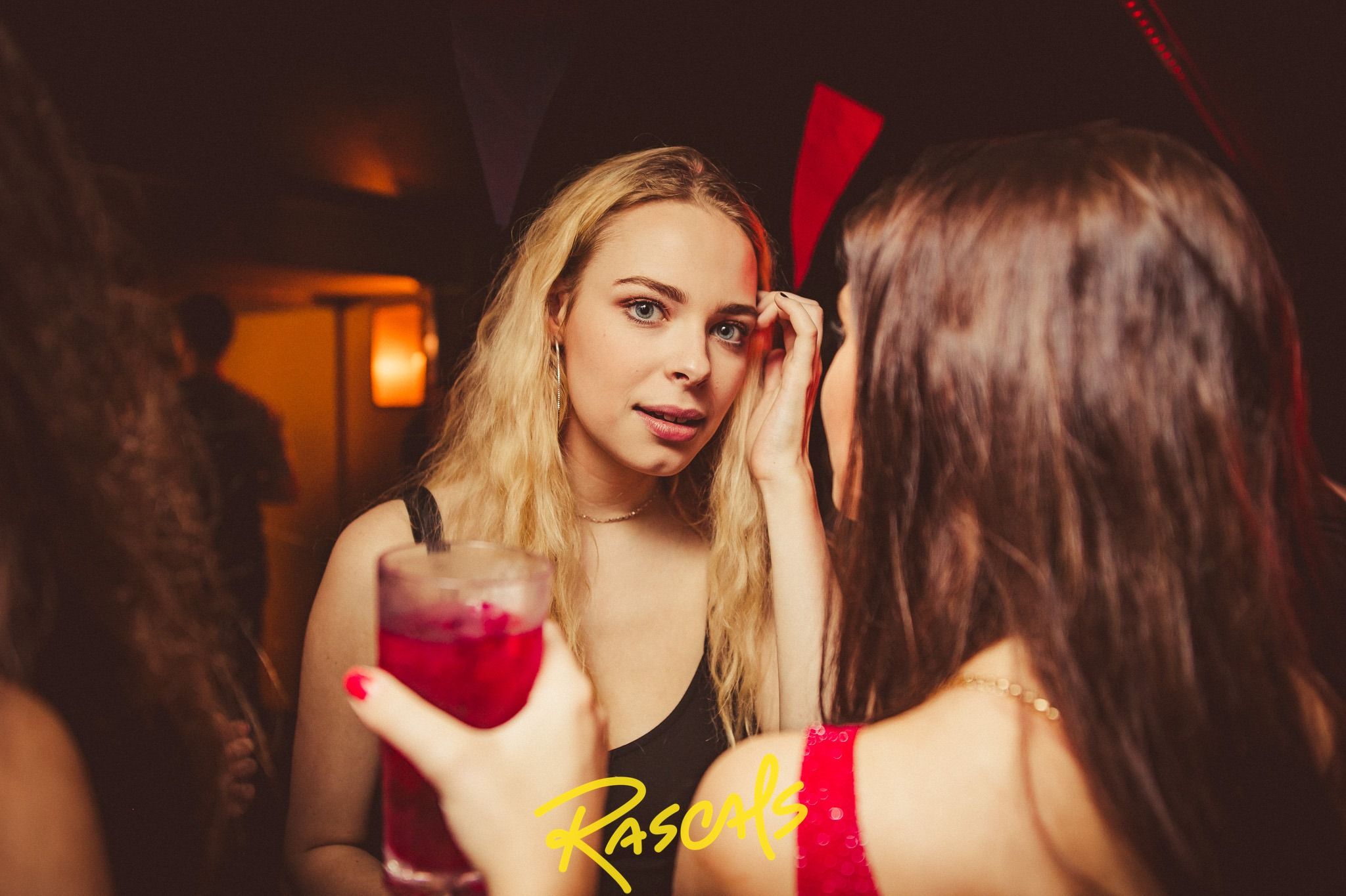 Image may contain: Finger, Night Club, Beverage, Drink, Club, Night Life, Human, Person