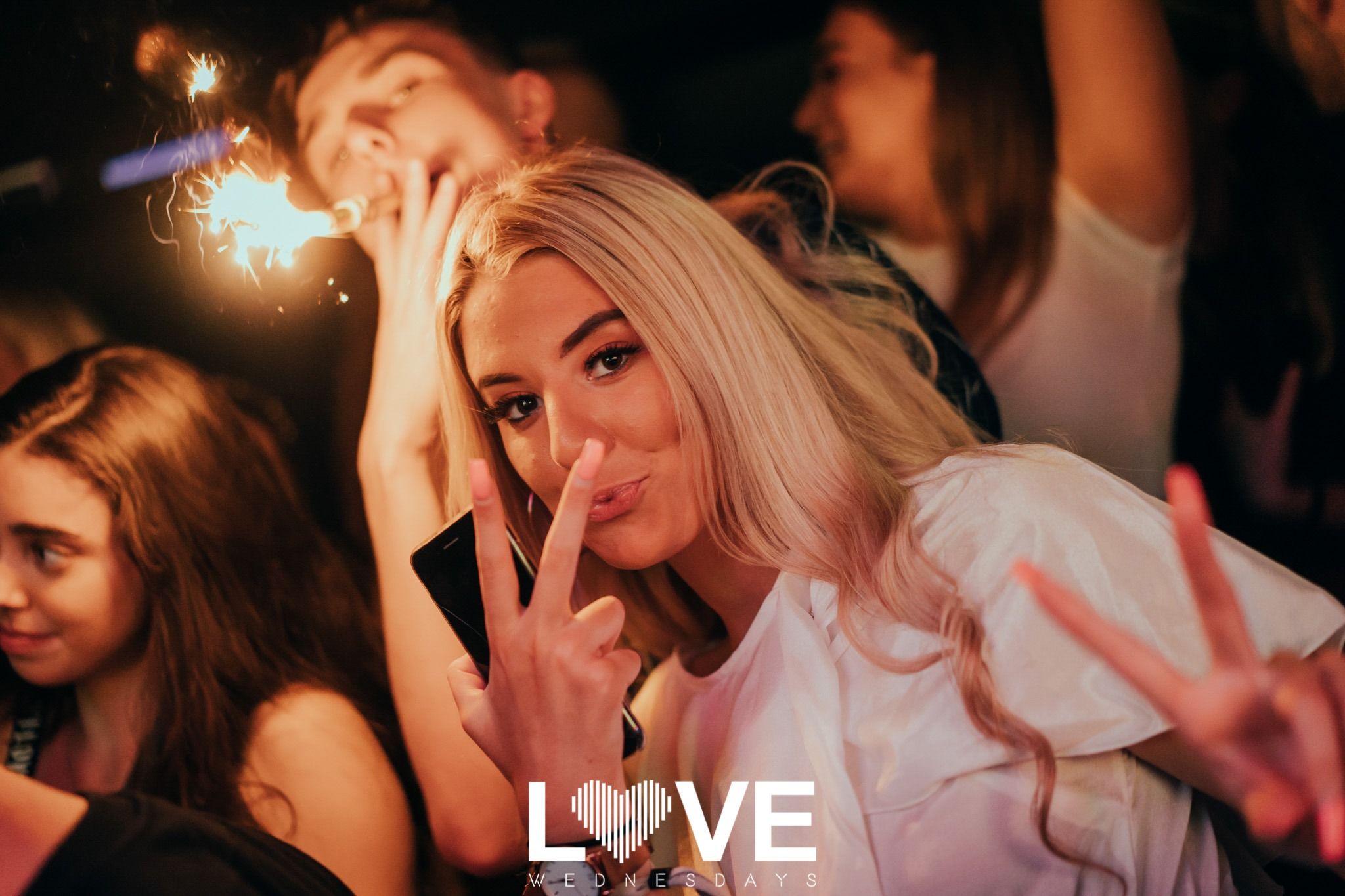 Image may contain: Finger, Party, Night Club, Club, Night Life, Person, Human