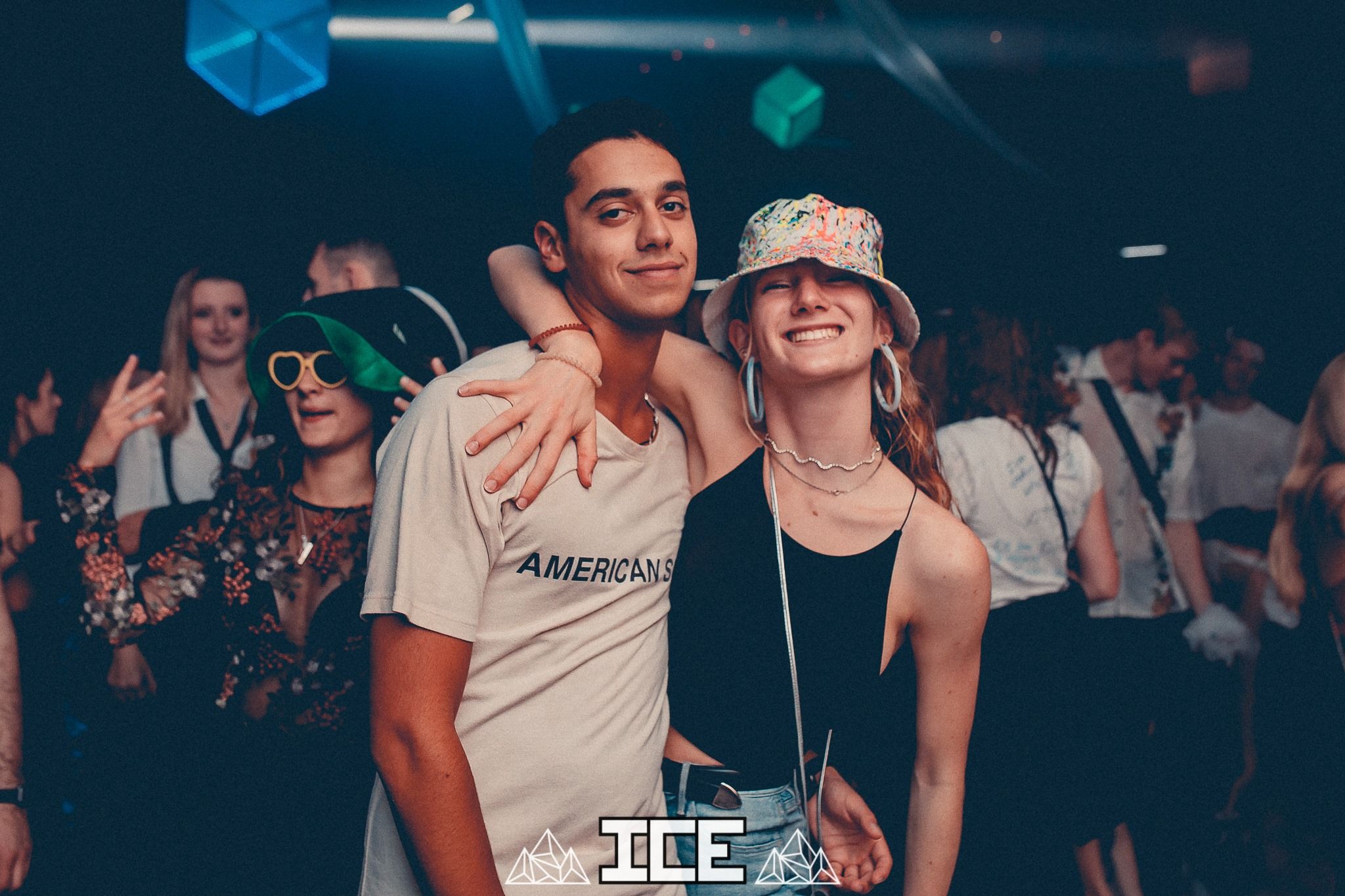 Image may contain: Night Club, Club, Sunglasses, Accessory, Accessories, Hat, Apparel, Clothing, Human, Person
