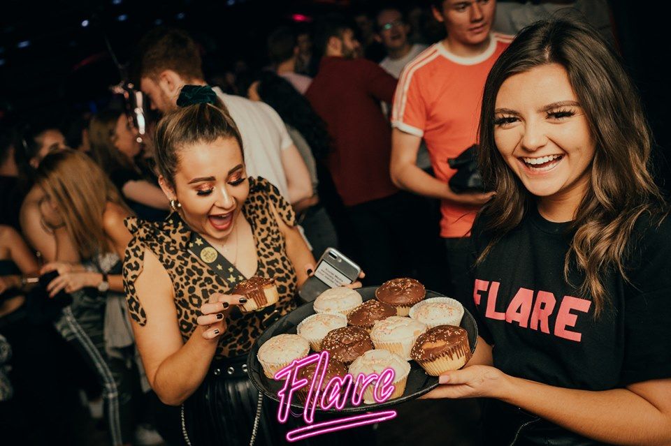 Image may contain: Night Life, Bar Counter, Pub, Cupcake, Confectionery, Sweets, Burger, Food, Creme, Dessert, Cream, Icing, Cake, Human, Person