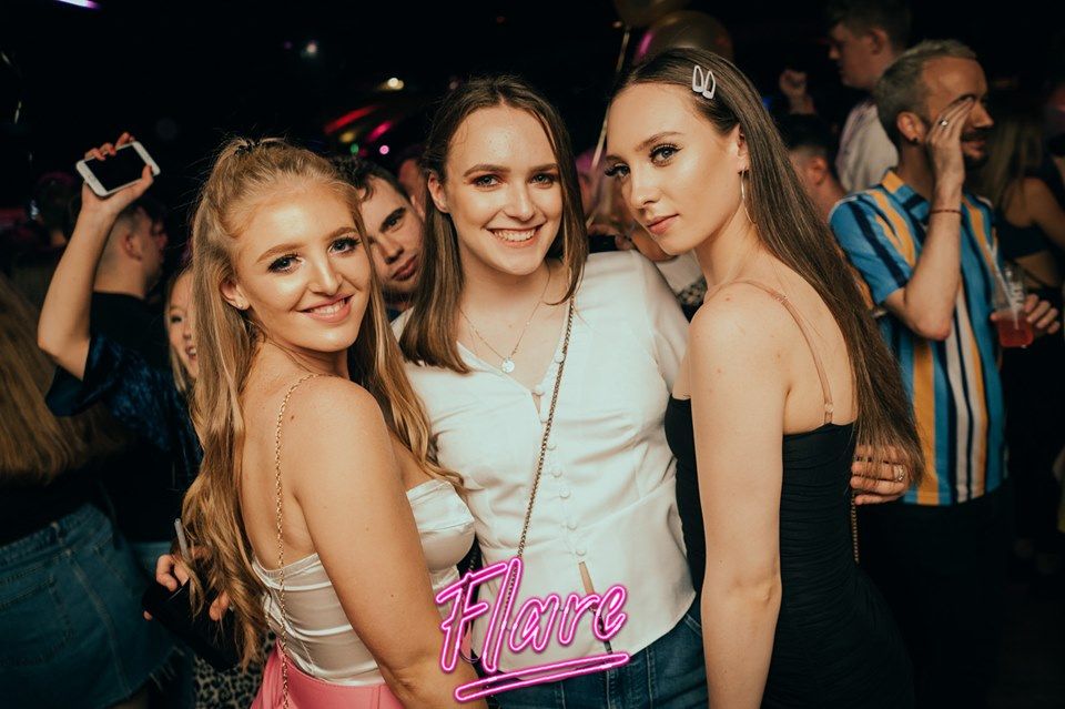 Image may contain: Night Life, Night Club, Party, Club, Evening Dress, Fashion, Clothing, Apparel, Gown, Robe, Person, Human