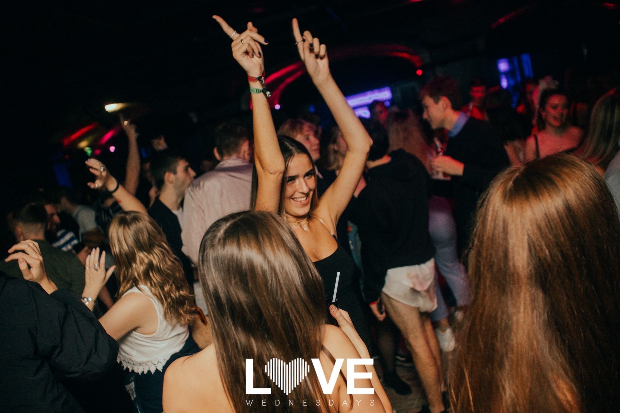 Image may contain: Back, Disco, Night Club, Club, Party, Night Life, Human, Person