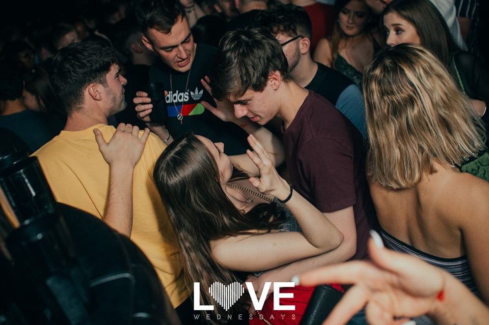 Image may contain: Bar Counter, Pub, Indoors, Interior Design, Night Club, Audience, Crowd, Club, Night Life, Party, Human, Person