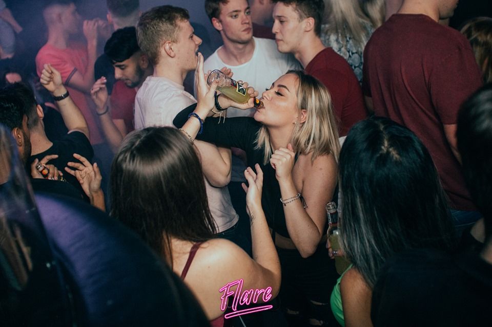 Image may contain: Bar Counter, Pub, Night Club, Club, Night Life, Party, Person, Human