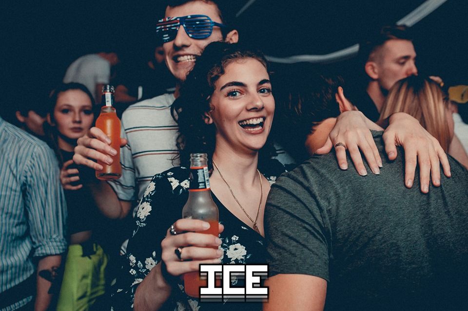 Image may contain: Bottle, Night Club, Club, Beer, Beverage, Alcohol, Drink, Party, Accessory, Sunglasses, Accessories, Person, Human