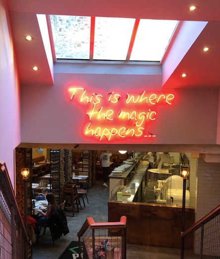 Image may contain: Cafe, Cafeteria, Window, Indoors, Interior Design, Shop, Person, Human, Restaurant