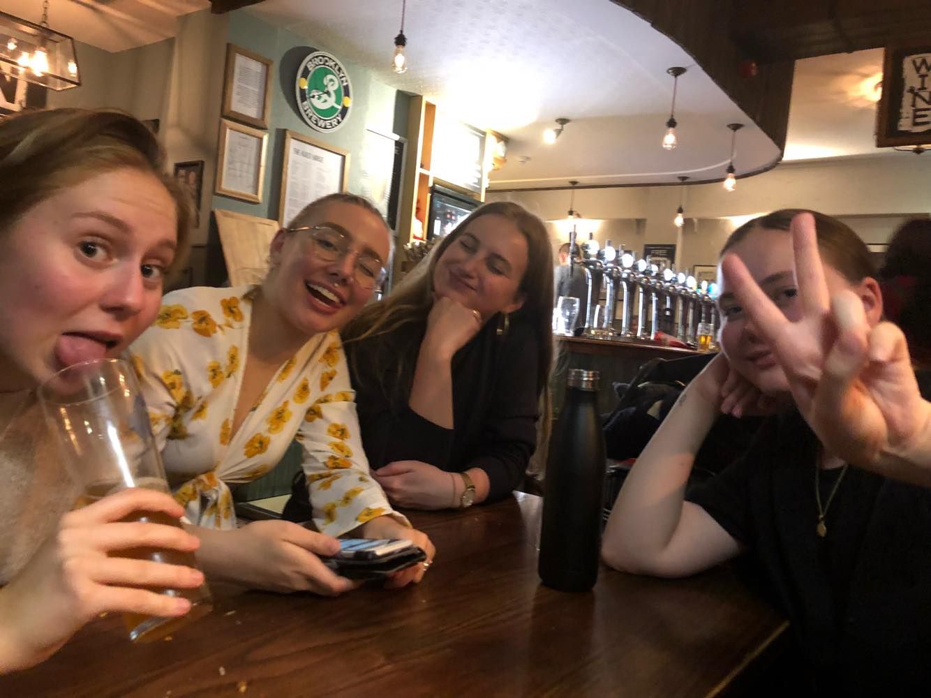 Image may contain: Food Court, Food, Drink, Beverage, Accessory, Glasses, Accessories, Restaurant, Furniture, Couch, Bar Counter, Pub, Hardwood, Wood, Person, Human