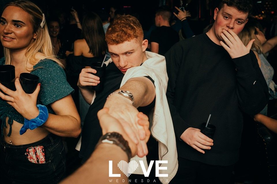 Image may contain: Hand, Sunglasses, Accessory, Accessories, Crowd, Pub, Bar Counter, Party, Night Club, Club, Person, Human