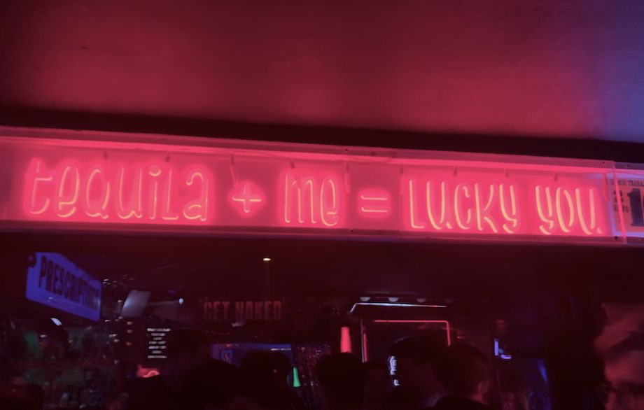 Image may contain: Neon, Night Club, Club, Human, Person, Light