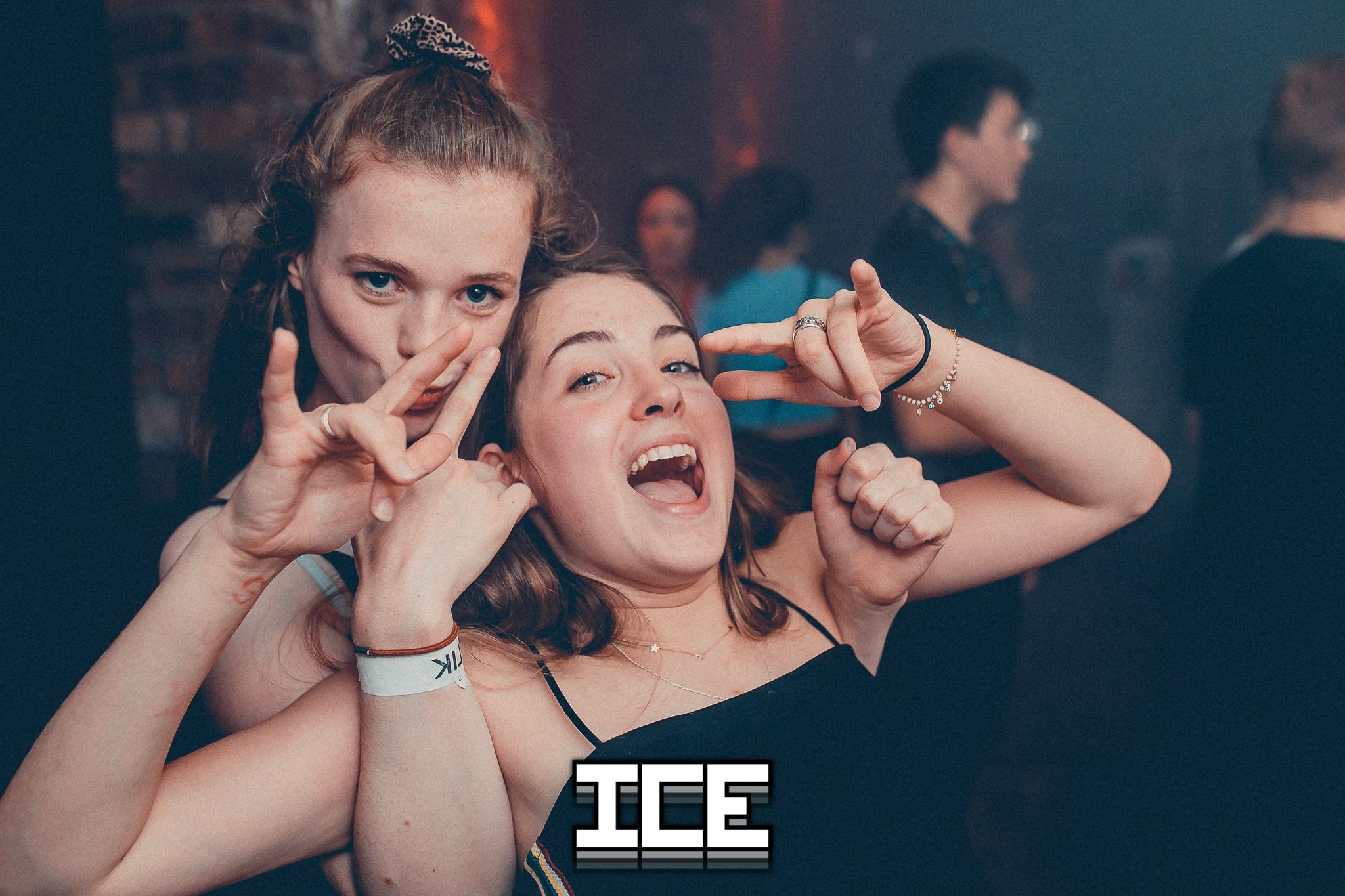 Image may contain: Party, Finger, Night Club, Club, Person, Human
