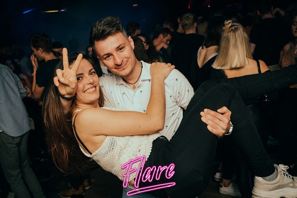 Image may contain: Pub, Party, Night Life, Night Club, Club, Apparel, Footwear, Shoe, Clothing, Person, Human