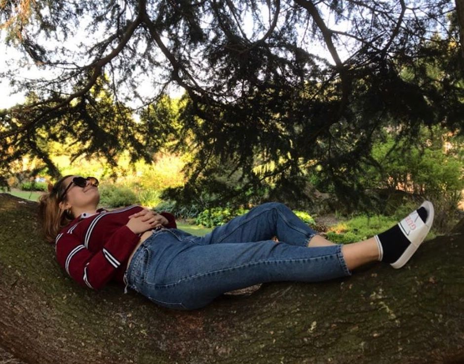 Image may contain: Woman, Forest, Woodland, Land, Nature, Sunglasses, Accessory, Accessories, Shoe, Bush, Footwear, Outdoors, Female, Face, Tree, Grass, Person, Human, Plant, Vegetation, Denim, Jeans, Pants, Clothing, Apparel