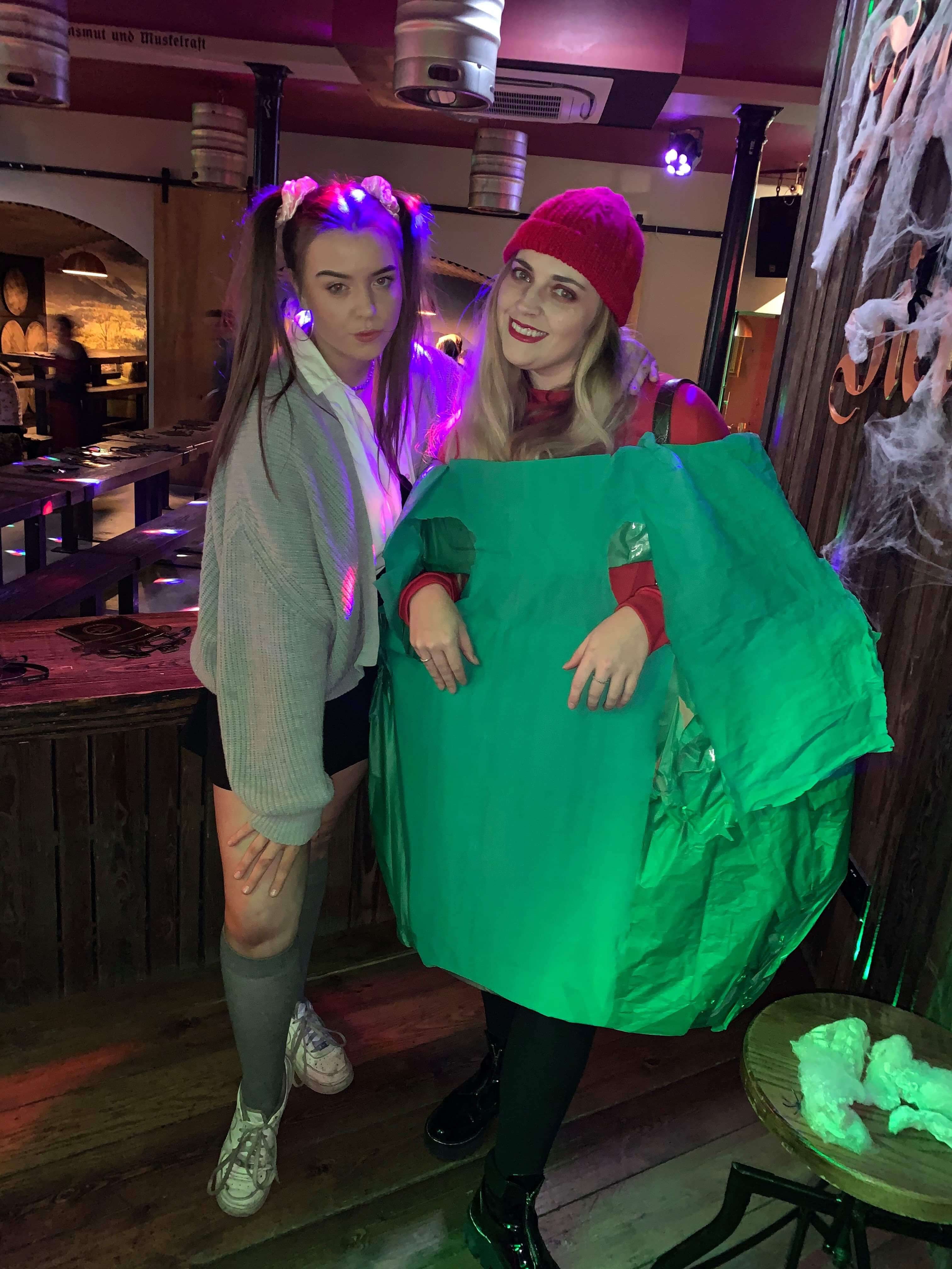 Image may contain: Cloak, Sleeve, Night Life, Fashion, Shoe, Footwear, Person, Human, Clothing, Apparel