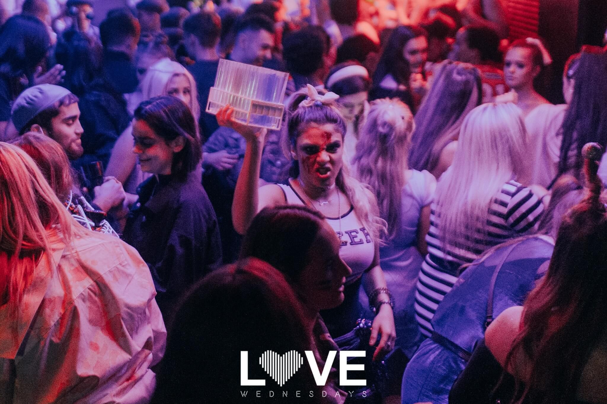 Image may contain: Crowd, Interior Design, Indoors, Night Club, Night Life, Accessory, Accessories, Sunglasses, Club, Party, Person, Human
