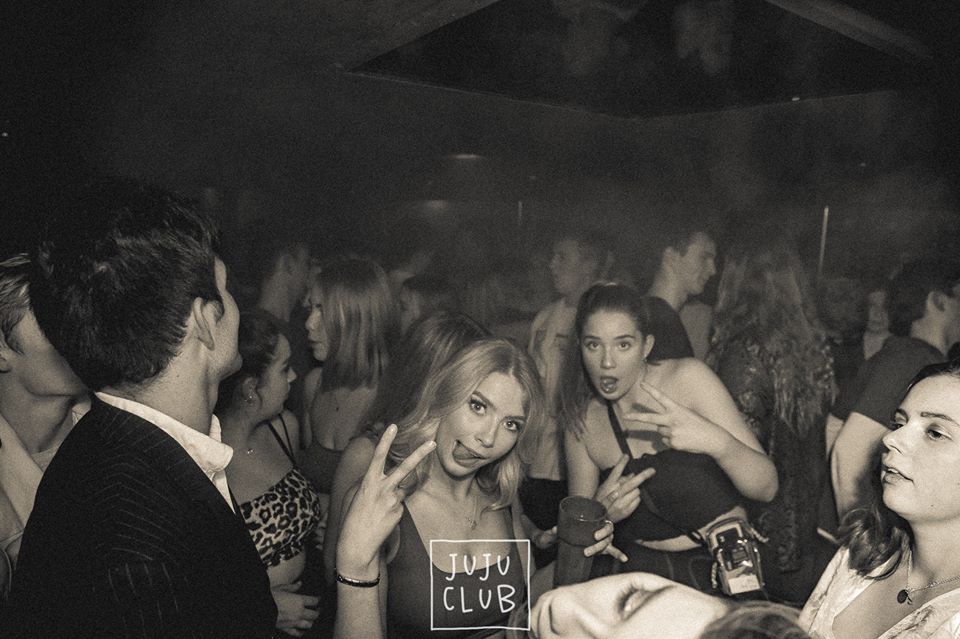 Image may contain: Crowd, Night Club, Night Life, Pub, Bar Counter, Club, Party, Person, Human