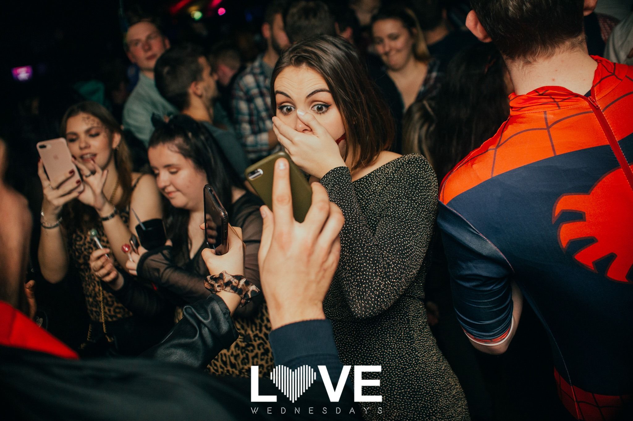 Image may contain: Party, Audience, Crowd, Night Life, Night Club, Club, Person, Human