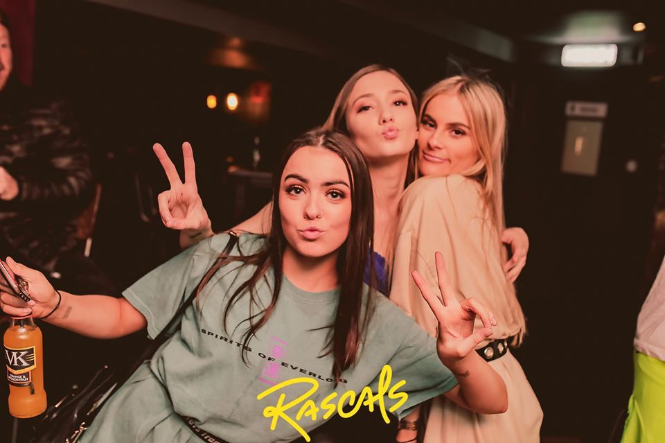 Image may contain: Portrait, Photo, Photography, Night Club, Club, Female, Apparel, Clothing, Alcohol, Beverage, Beer, Drink, Face, Human, Person