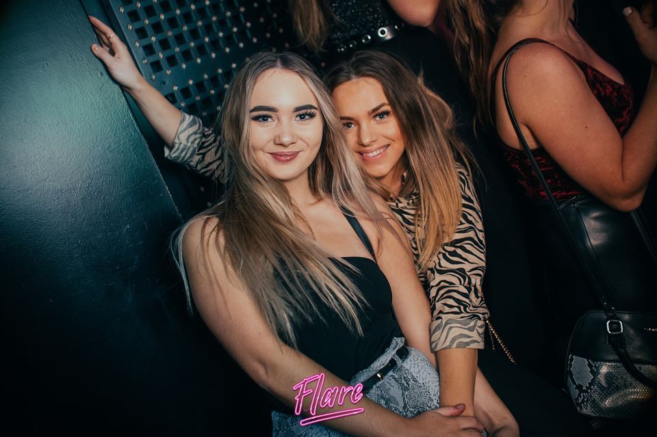 Image may contain: Skin, Night Club, Club, Face, Night Life, Person, Human