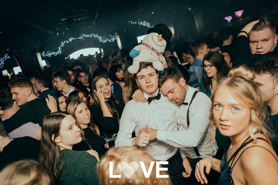 Image may contain: Hat, Clothing, Apparel, Audience, Crowd, Night Life, Night Club, Club, Party, Human, Person