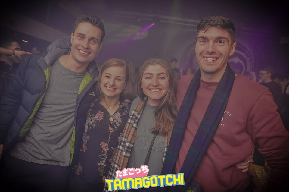 Image may contain: Portrait, Photography, Photo, Overcoat, Coat, Suit, Apparel, Clothing, Night Club, Party, Club, Face, Person, Human