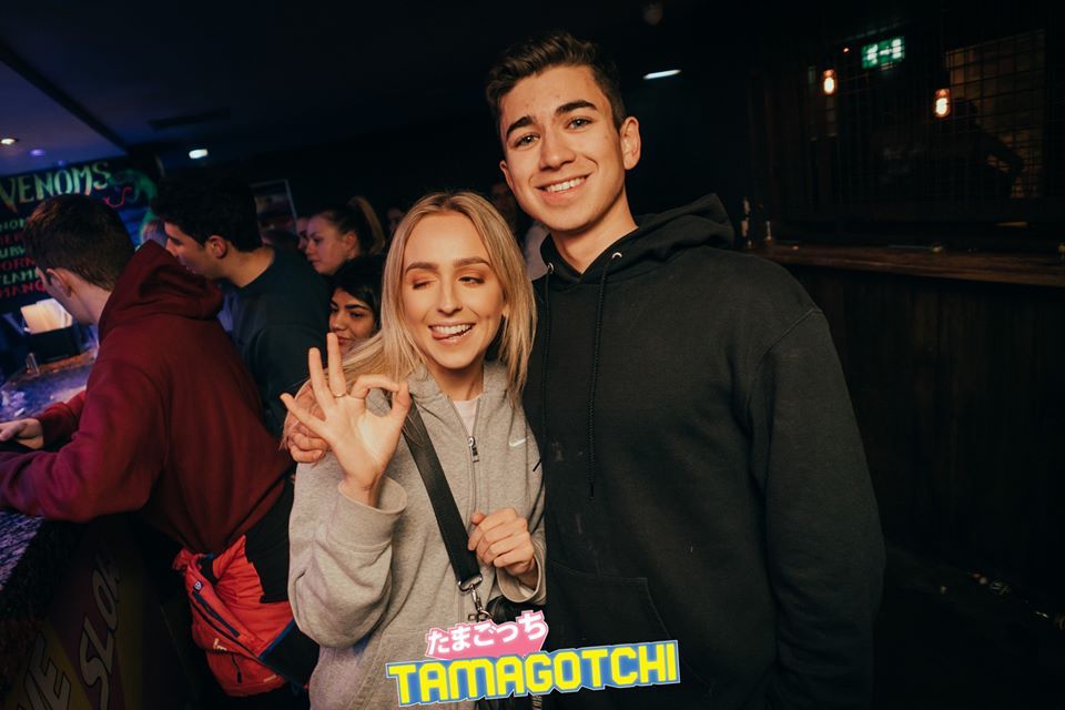 Image may contain: Face, Pub, Bar Counter, Jacket, Coat, Night Life, Night Club, Apparel, Clothing, Club, Party, Human, Person