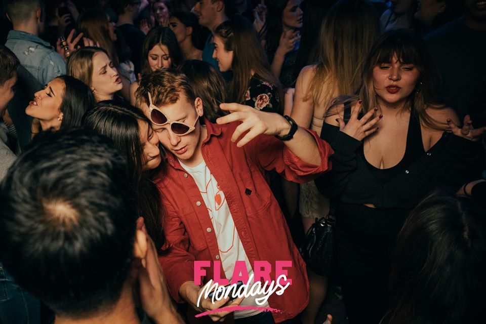 Image may contain: Night Club, Club, Party, Audience, Crowd, Sunglasses, Accessories, Accessory, Night Life, Person, Human