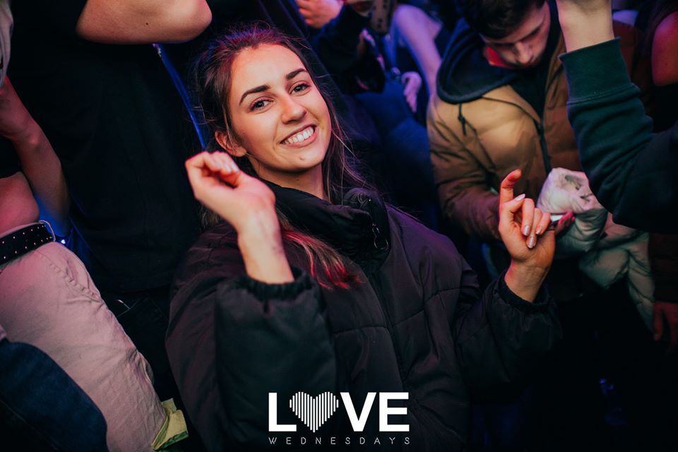 Image may contain: Night Life, Wristwatch, Night Club, Club, Party, Human, Person