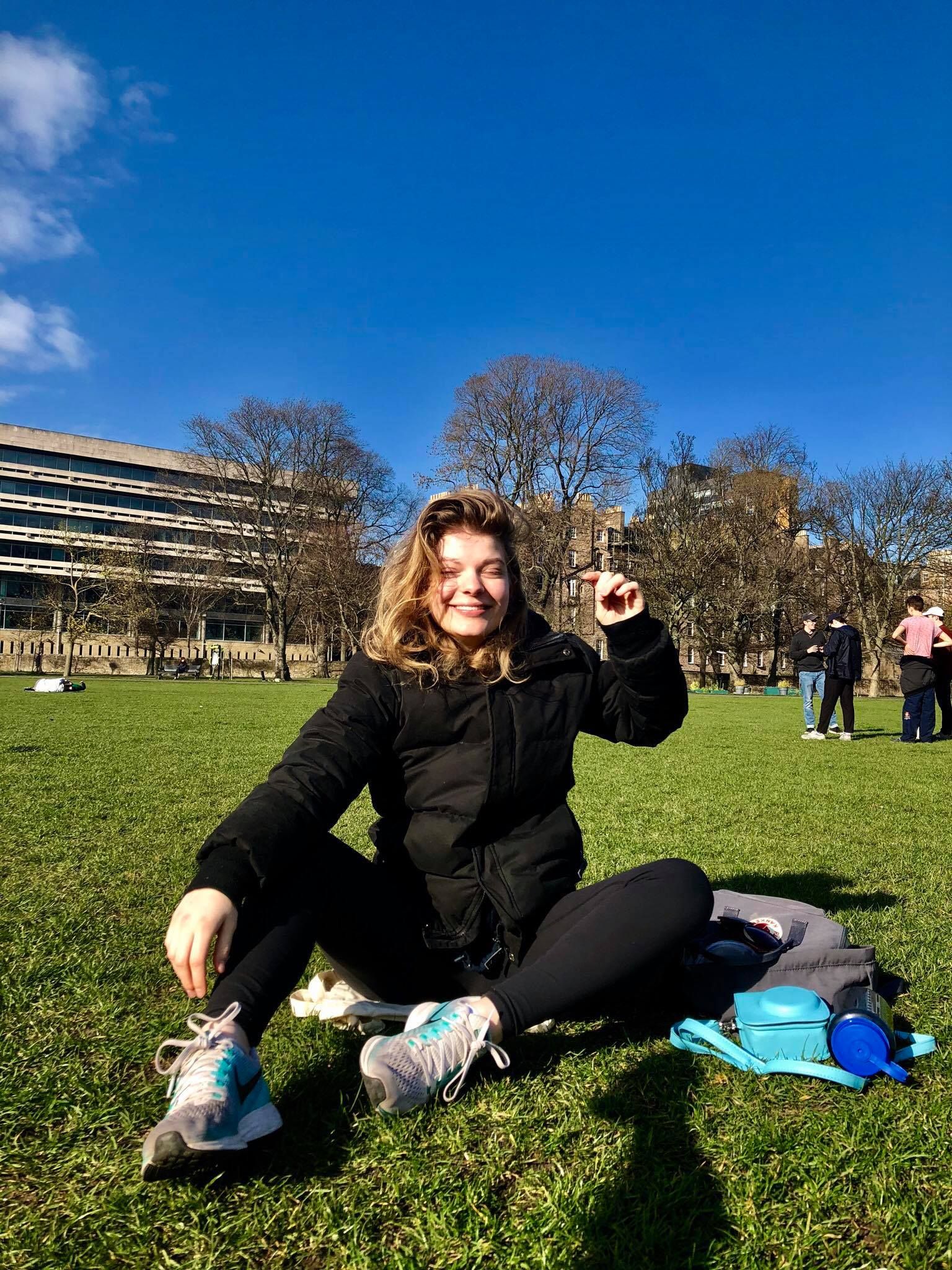 Image may contain: Outdoors, Lawn, Meal, Food, Campus, Vegetation, Grass, Plant, Person, Human, Shoe, Apparel, Clothing, Footwear