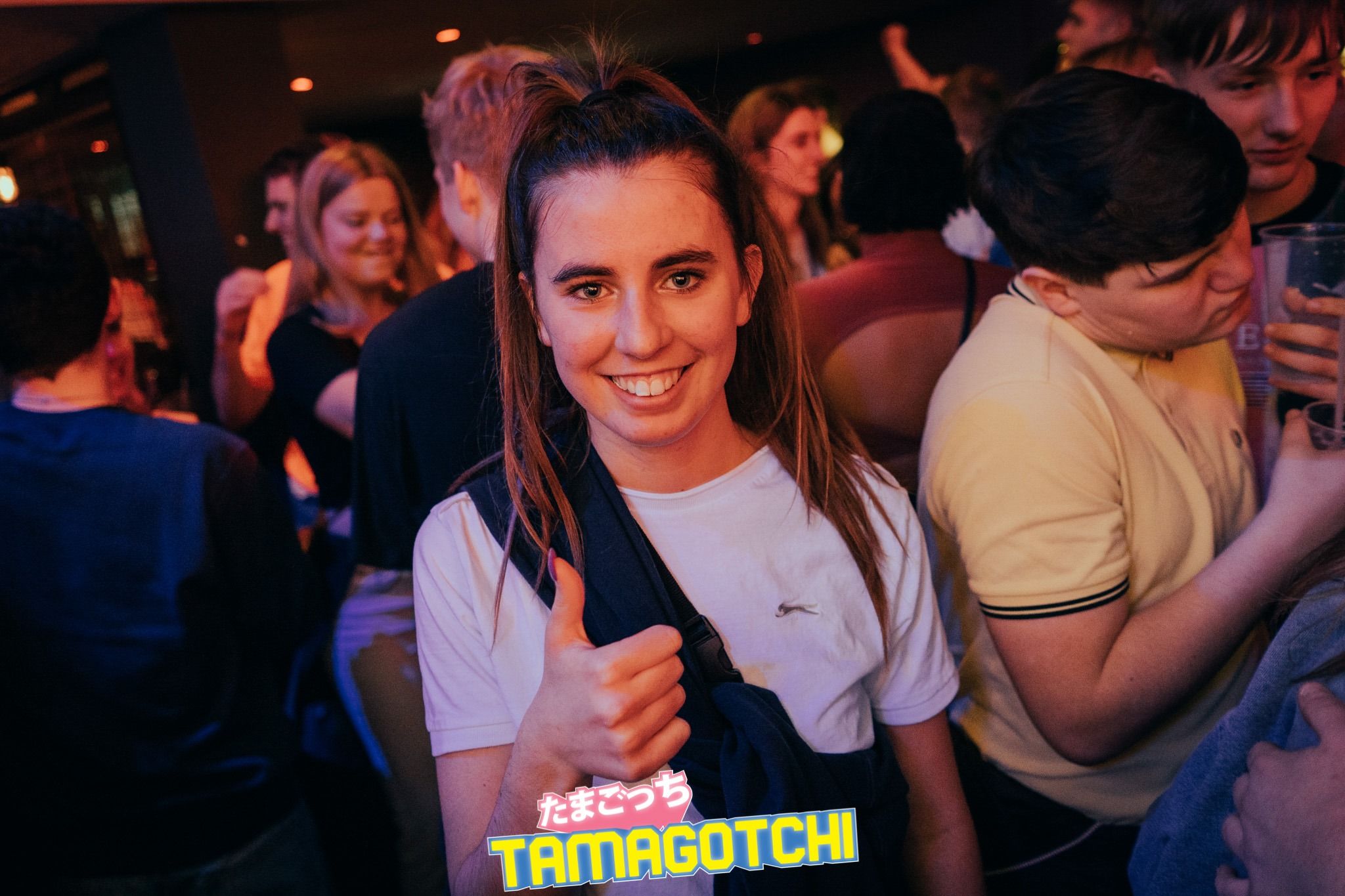 Image may contain: Accessories, Accessory, Sunglasses, Audience, Crowd, Pub, Bar Counter, Finger, Night Club, Club, Night Life, Person, Human