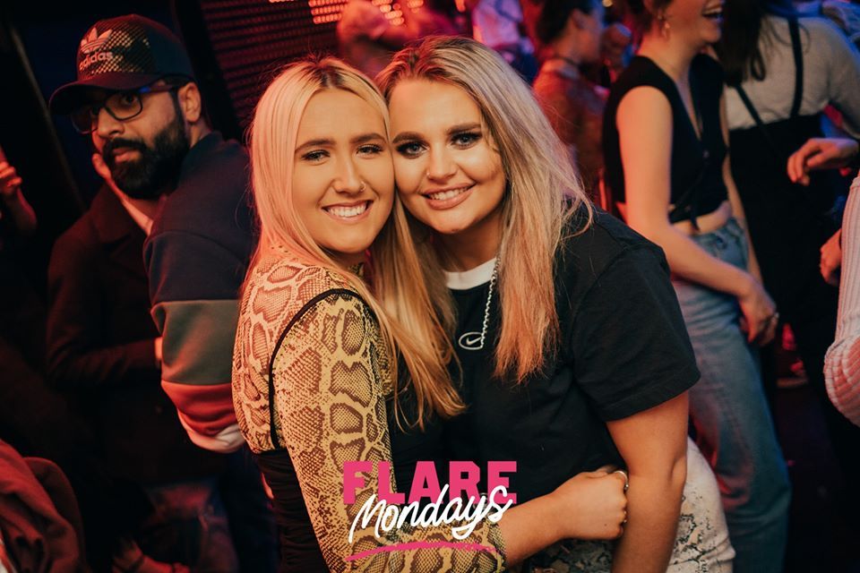 Image may contain: Clothing, Apparel, Hat, Night Club, Club, Night Life, Party, Face, Person, Human