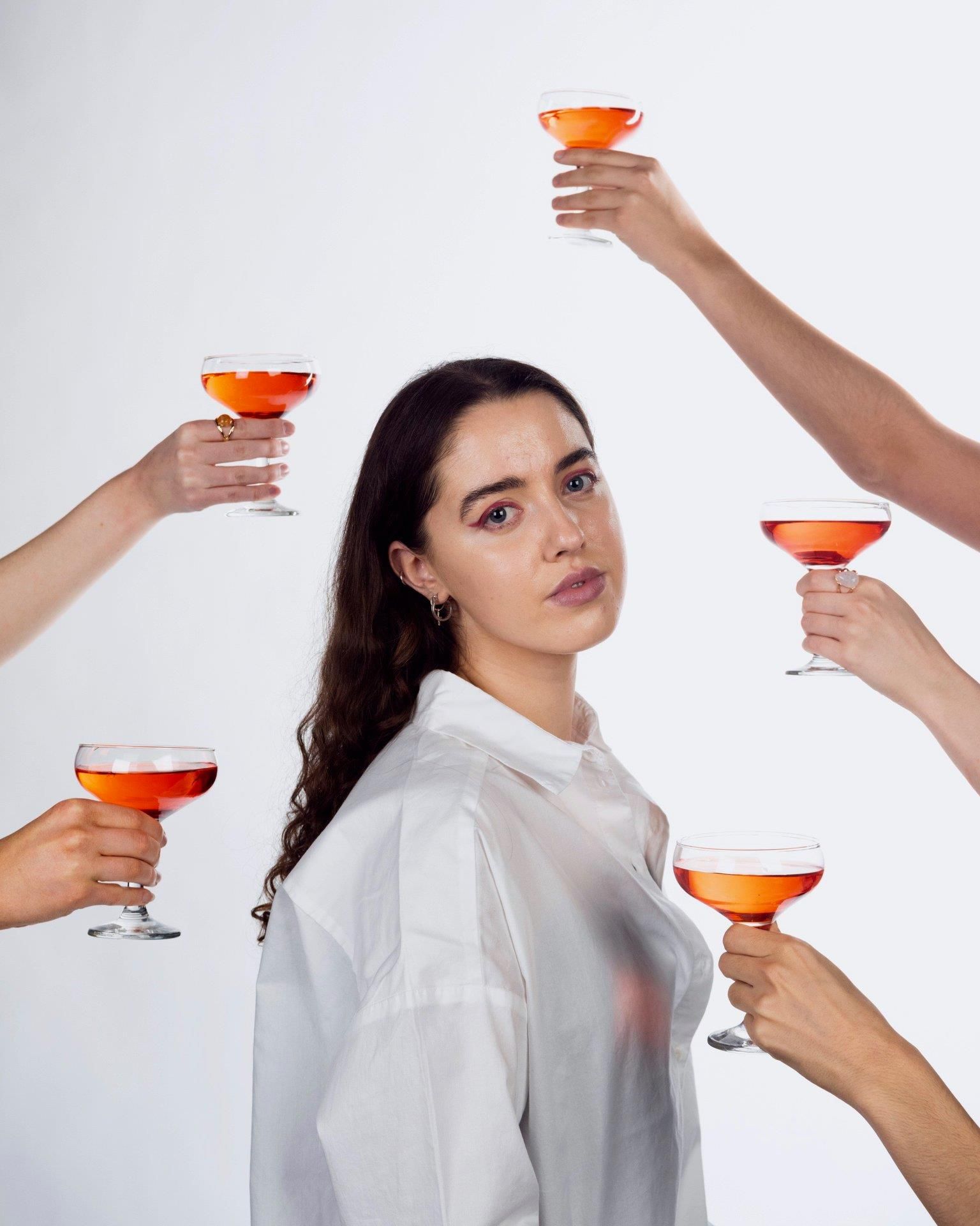 Image may contain: Cocktail, Alcohol, Drinking, Goblet, Drink, Beverage, Person, Human, Glass