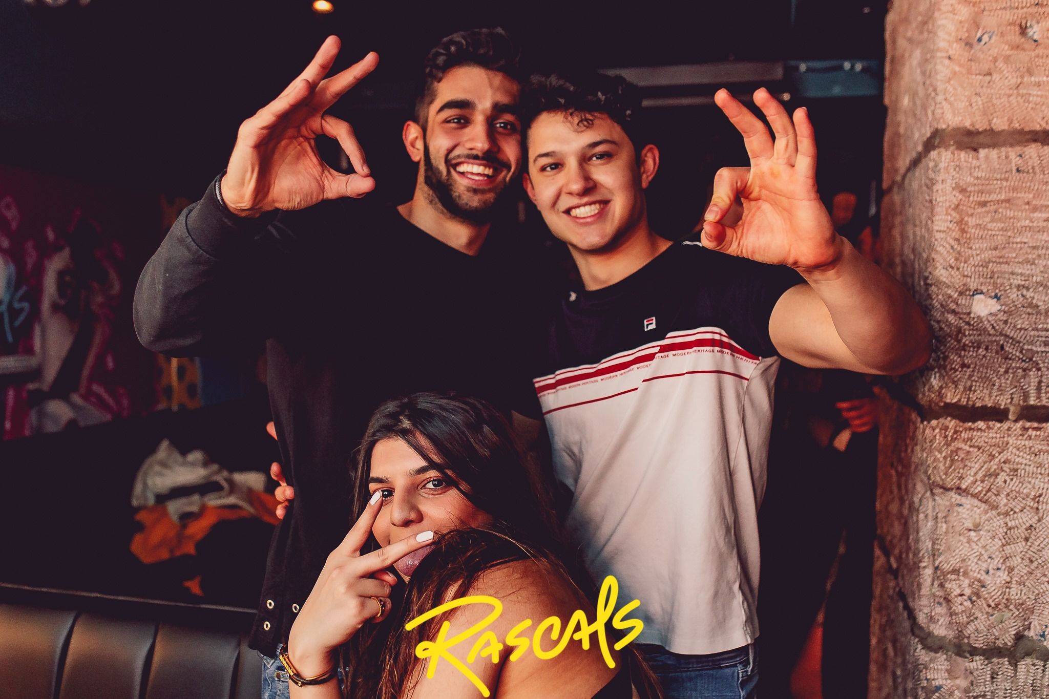 Image may contain: Finger, Party, Night Club, Club, Person, Human