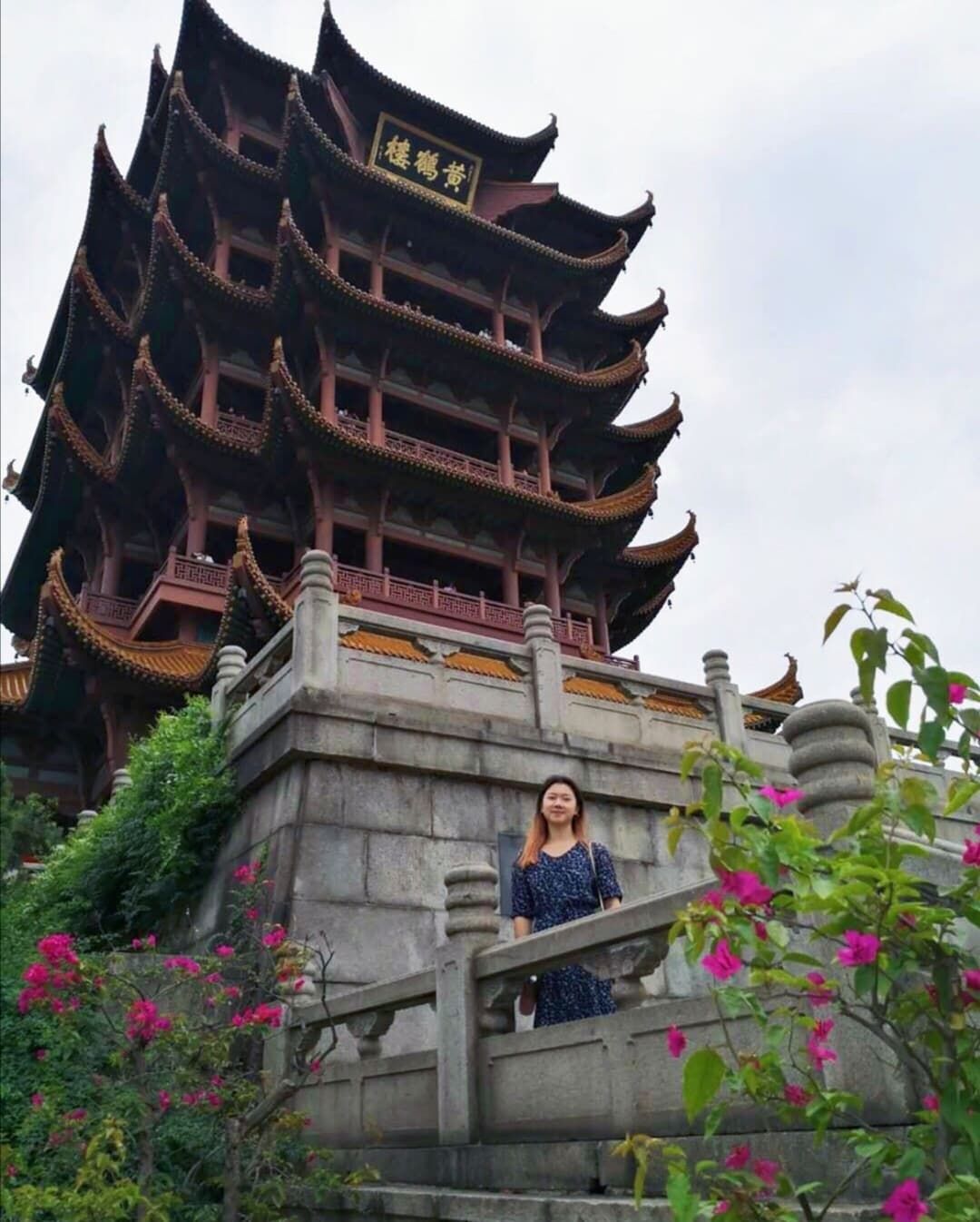 Image may contain: Outdoors, Town, Urban, City, Metropolis, Temple, Pagoda, Shrine, Worship, Architecture, Building, Human, Person