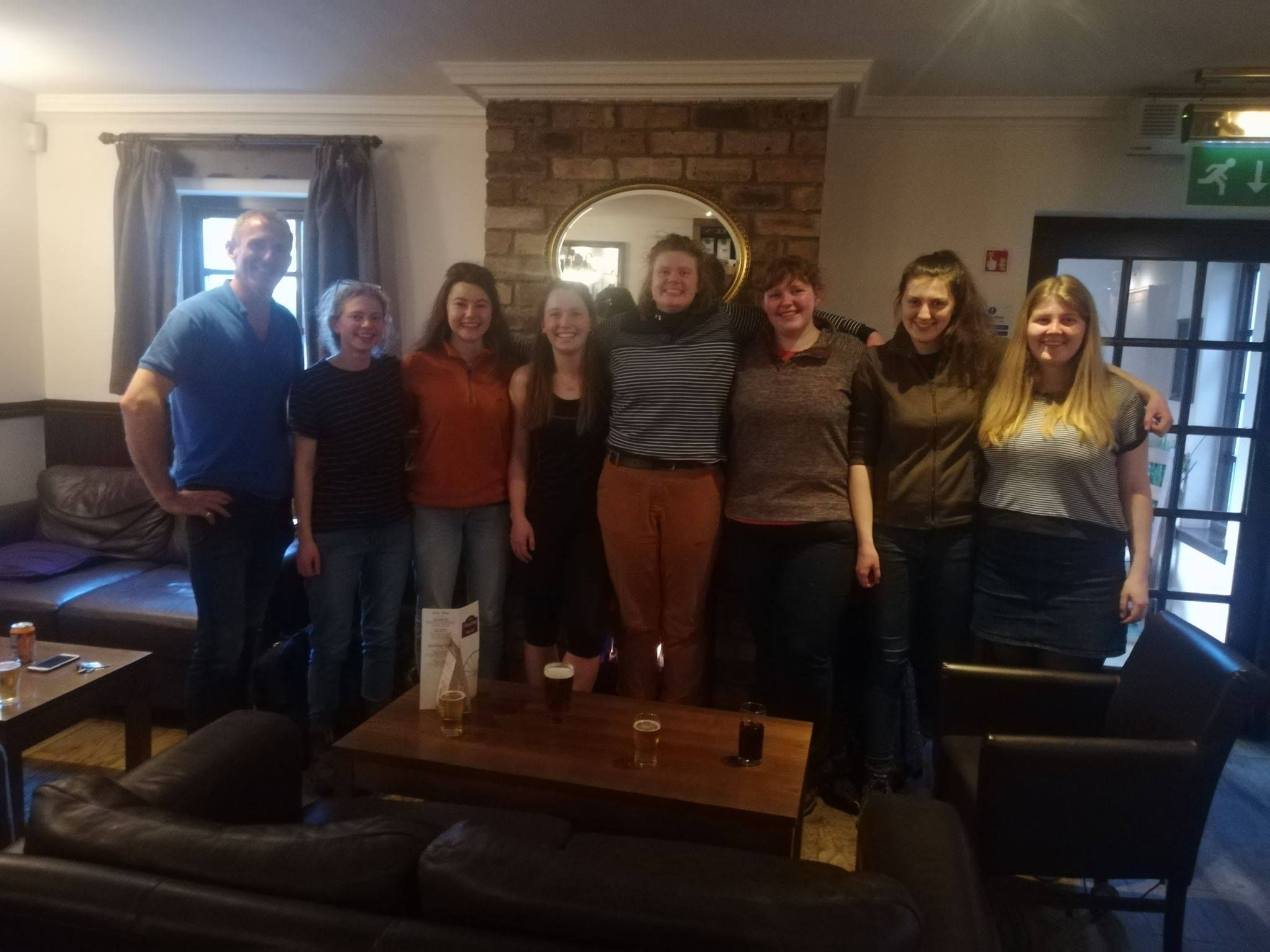 Image may contain: Pants, Wood, Interior Design, Bar Counter, Waiting Room, Sitting, Apparel, Clothing, Pub, Living Room, Room, Indoors, Furniture, Couch, Person, Human