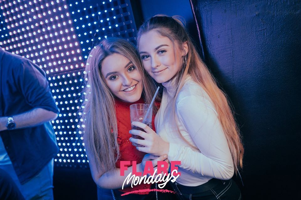 Image may contain: Party, Drink, Beverage, Face, Night Club, Night Life, Club, Human, Person