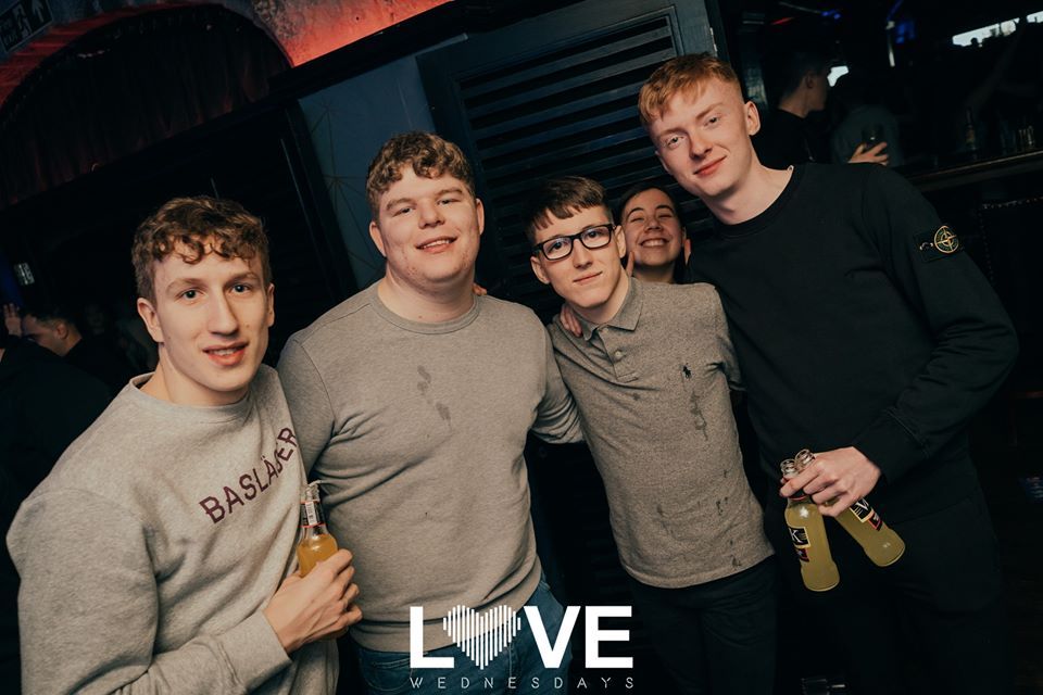 Image may contain: Sleeve, T-Shirt, People, Bar Counter, Pub, Night Club, Night Life, Accessories, Glasses, Accessory, Club, Party, Clothing, Apparel, Human, Person