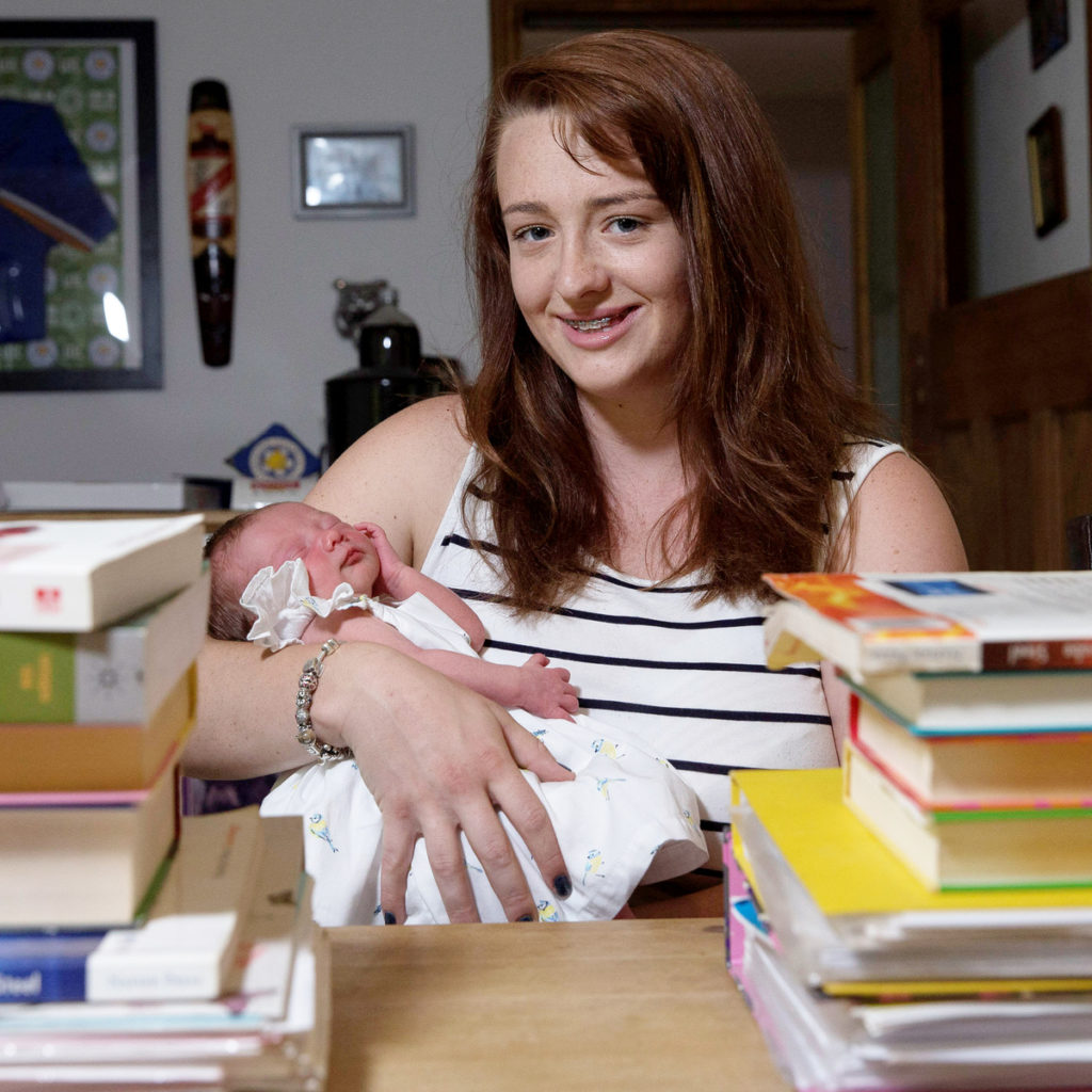 Georgia Hollis-Whitaker, who gave birth to daughter Olivia O’Callaghan just hours before her university graduation ceremony. See NTI story NTIBABY. Olivia was born weighing 5lb 15oz at 12.46am on Friday – two weeks earlier than expected – to proud parents Georgia Hollis-Whitaker and dad Jamie O’Callaghan, of Leicester. So she was there, swaddled in her grandmother’s arms, to see mum Georgia graduate and collect her First Class degree in Sociology at The Venue at 2.30pm on Saturday, along with a prize awarded by the Sociology department to the student who showed outstanding dedication on her course. Georgia left the Leicester Royal Infirmary at 6am on Friday and had a mad scramble to get her gown sorted and everything organised, but she could not be happier that Olivia could be part of her graduation day. “She wasn’t due for another two weeks so I thought I would be pregnant on my graduation day, but I’m so glad she’s here,” said Georgia, beaming. “She’ll be on all my graduation pictures.”