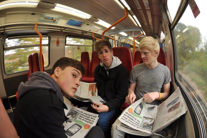 three teenagers on the train from Surrey to London
