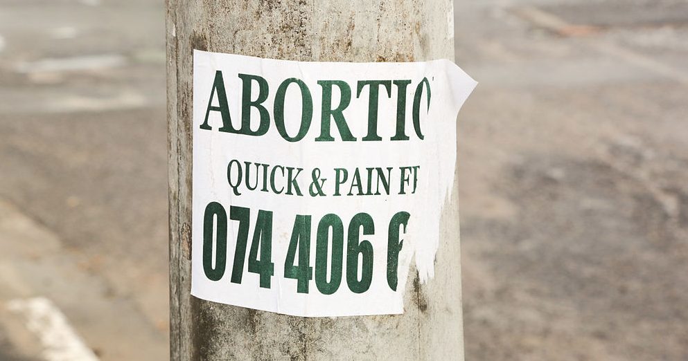 1024px-Abortion_Quick_&_Pain_Free_sign,_Joe_Slovo_Park,_Cape_Town,_South_Africa-3869