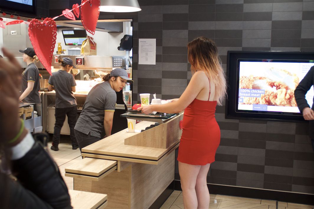 Image may contain: Restaurant, Food Court, Food, Wood, Plywood, Person, People, Human
