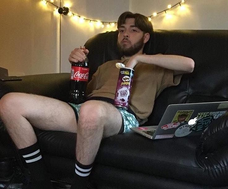 Image may contain: Drink, Coke, Beverage, Furniture, Couch, Person, People, Human, Bottle