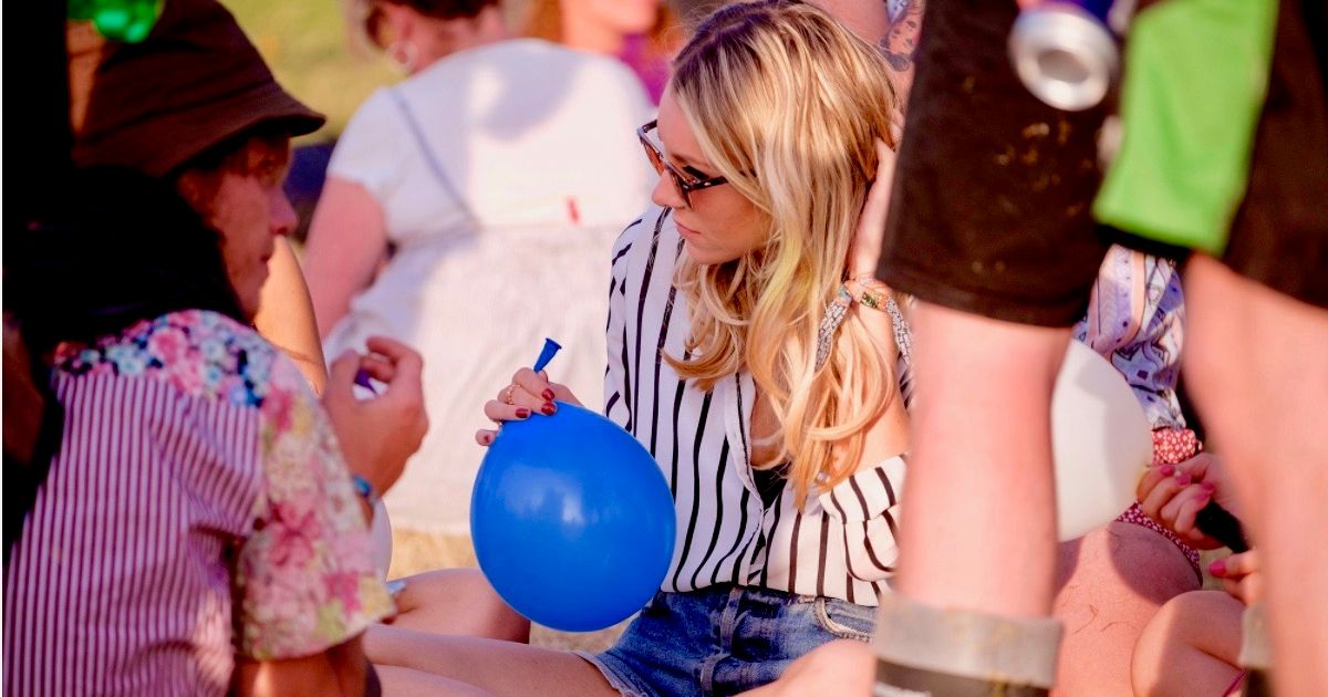 Image may contain: Woman, Girl, Female, Blonde, Sphere, Ball, Cup, Person, People, Human