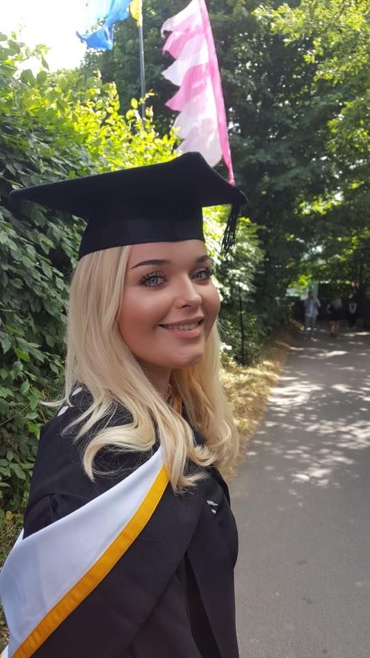 Image may contain: Plant, Flora, Algae, Smile, Portrait, Face, Graduation, Person, People, Human