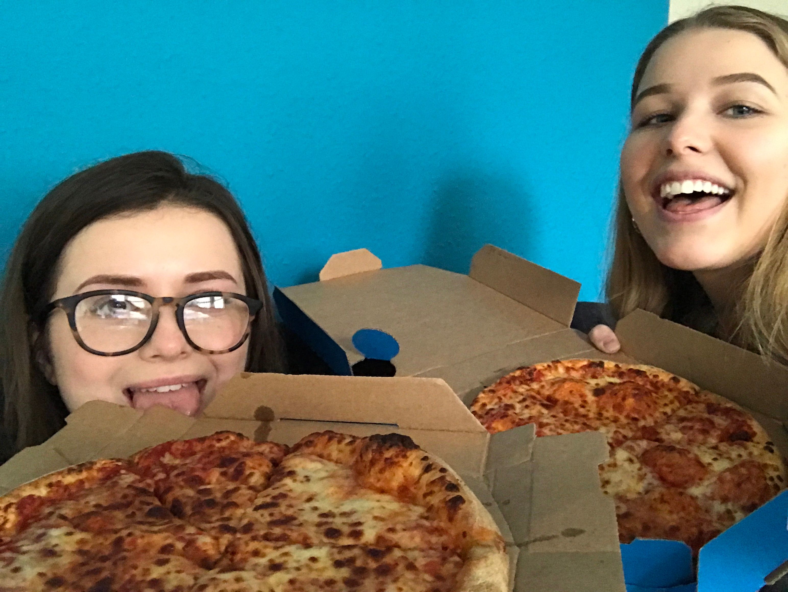 Image may contain: Person, People, Human, Pizza, Food