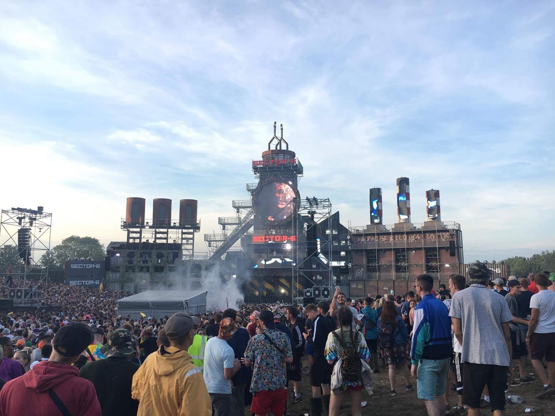 Image may contain: Back, Factory, Building, Crowd, Person, People, Human