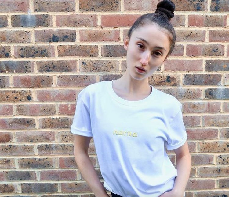 Image may contain: Sleeve, Photography, Portrait, Photo, Wall, T-Shirt, Girl, Female, Face, Brick, Person, Human, Apparel, Clothing