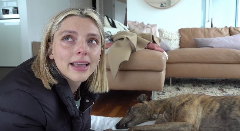 Image may contain: Room, Cushion, Indoors, Canine, Dog, Pet, Mammal, Animal, Couch, Furniture, Face, Clothing, Apparel, Human, Person, Female, Teen, Woman, Child, Blonde, Kid, Girl